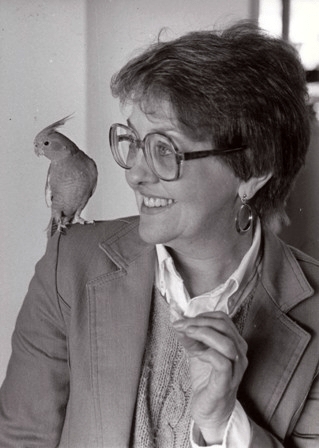 Martha Perske in black and white with her bird. 